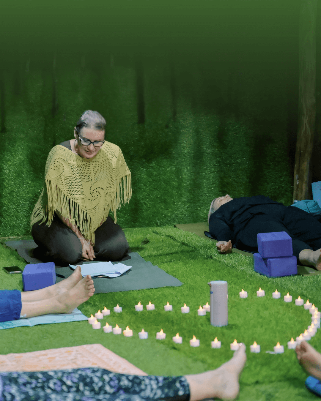 New Moon Intention Setting Class – Rebirth: A 4-Week Awakening at Unity Yoga Ayurveda A serene yoga teacher guiding a New Moon Intention Setting Class surrounded by candlelight and students in relaxation poses, symbolizing renewal, reflection, and inner balance during the Rebirth: A 4-Week Awakening yoga and Ayurveda program in Mackay.